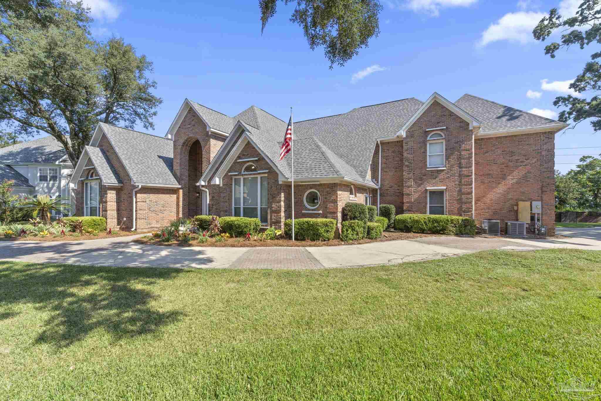4818 Rosemont Place Pensacola, FL 32514 - Photo 60 of 69 a front view of house with yard and green space