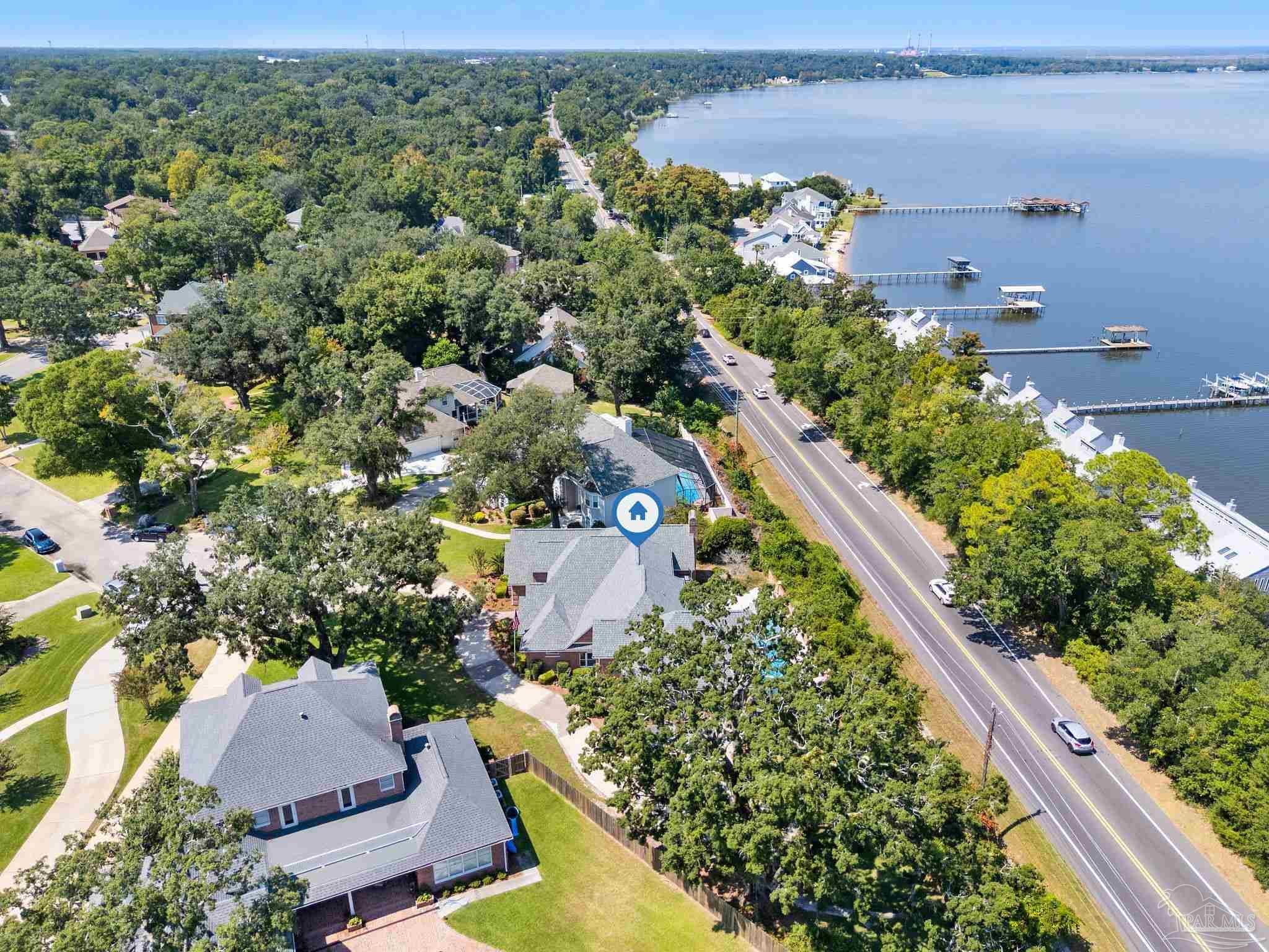 4818 Rosemont Place Pensacola, FL 32514 - Photo 68 of 69 an aerial view of a house with a garden and lake view