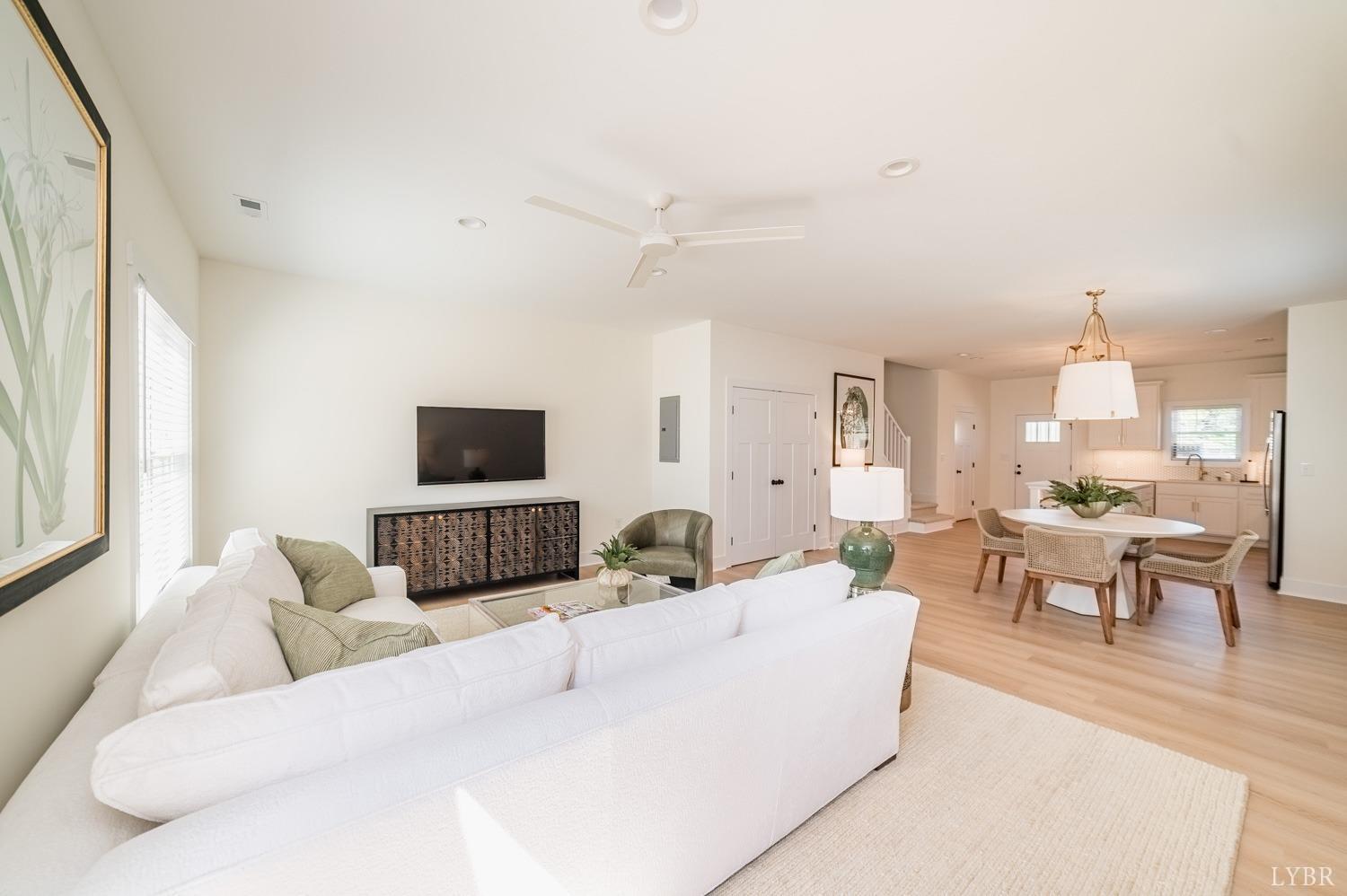 556 Leesville Road, Unit 208 Lynchburg, VA 24502 - Photo 14 of 40 a living room with furniture a flat screen tv and a large window