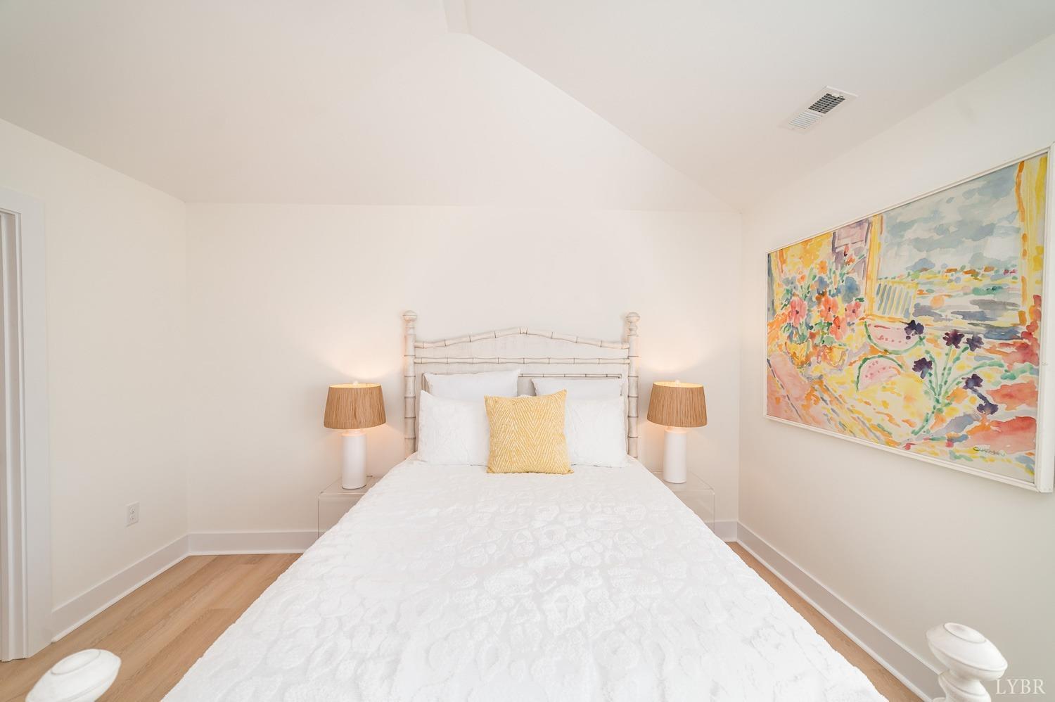 556 Leesville Road, Unit 208 Lynchburg, VA 24502 - Photo 22 of 40 a bedroom with a bed and a painting on the wall