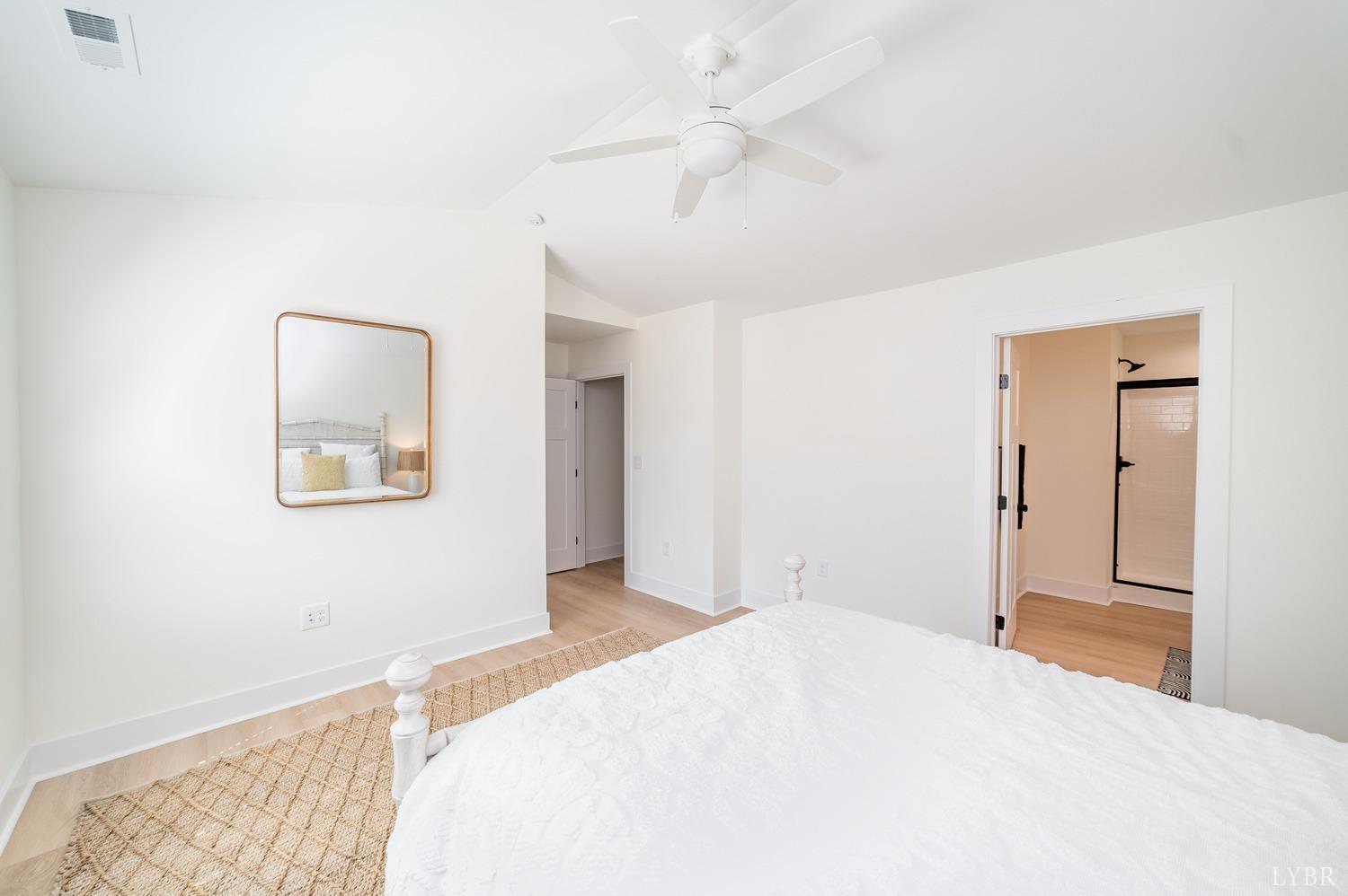 556 Leesville Road, Unit 208 Lynchburg, VA 24502 - Photo 24 of 40 a bedroom with a bed and a painting on the wall