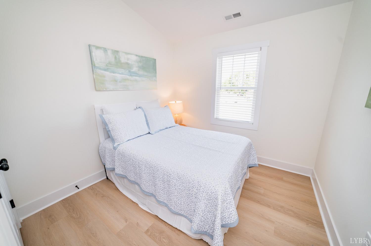 556 Leesville Road, Unit 208 Lynchburg, VA 24502 - Photo 33 of 40 a bed room with a bed and a painting