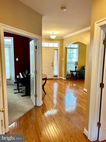 a view of a bedroom with furniture and a hardwood