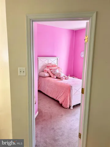 a bed room with a bed and a mirror