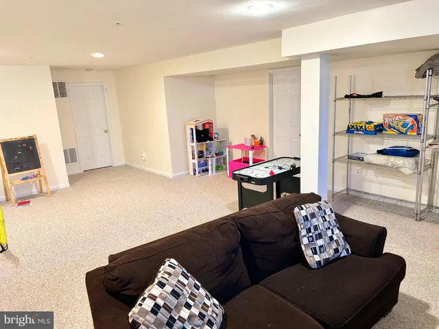 a living room with furniture and a couch