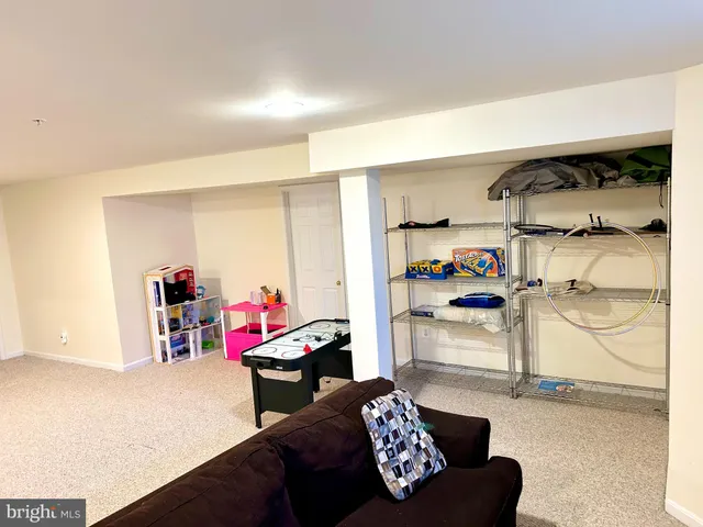 a bedroom with furniture and a closet