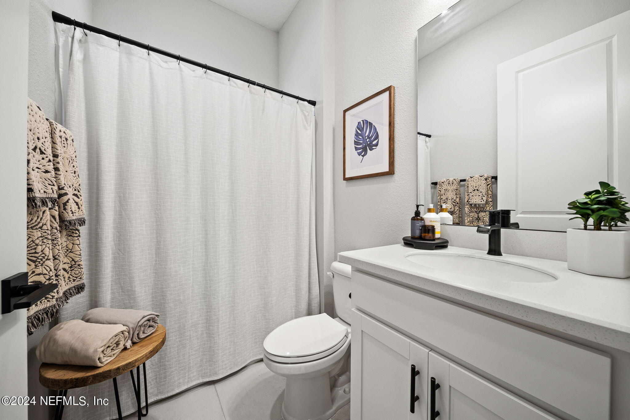 48 Bluebonnet Way St. Augustine, FL 32092 - Photo 18 of 47 a bathroom with a sink toilet and mirror