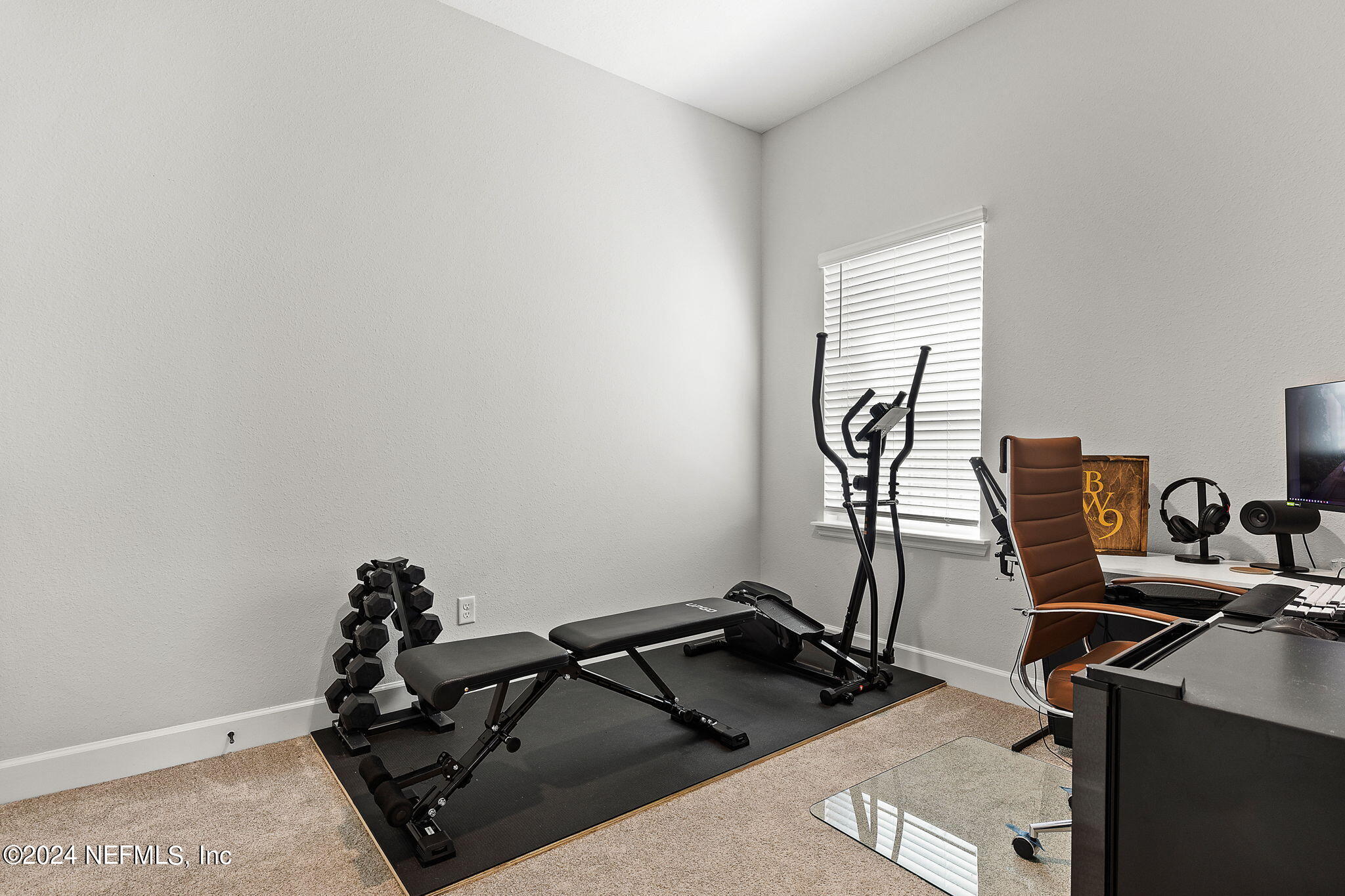 48 Bluebonnet Way St. Augustine, FL 32092 - Photo 19 of 47 a room with gym equipment and wooden floor