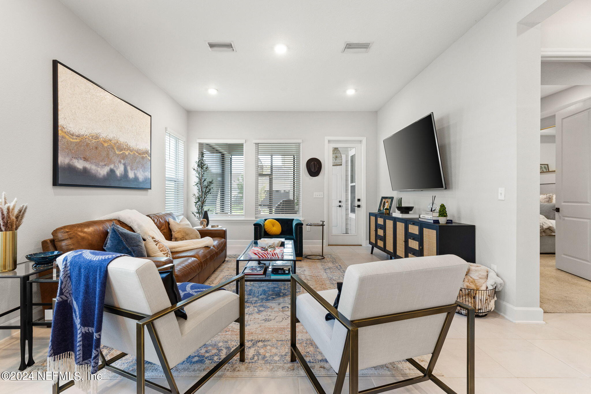 48 Bluebonnet Way St. Augustine, FL 32092 - Photo 23 of 47 a living room with furniture and a flat screen tv