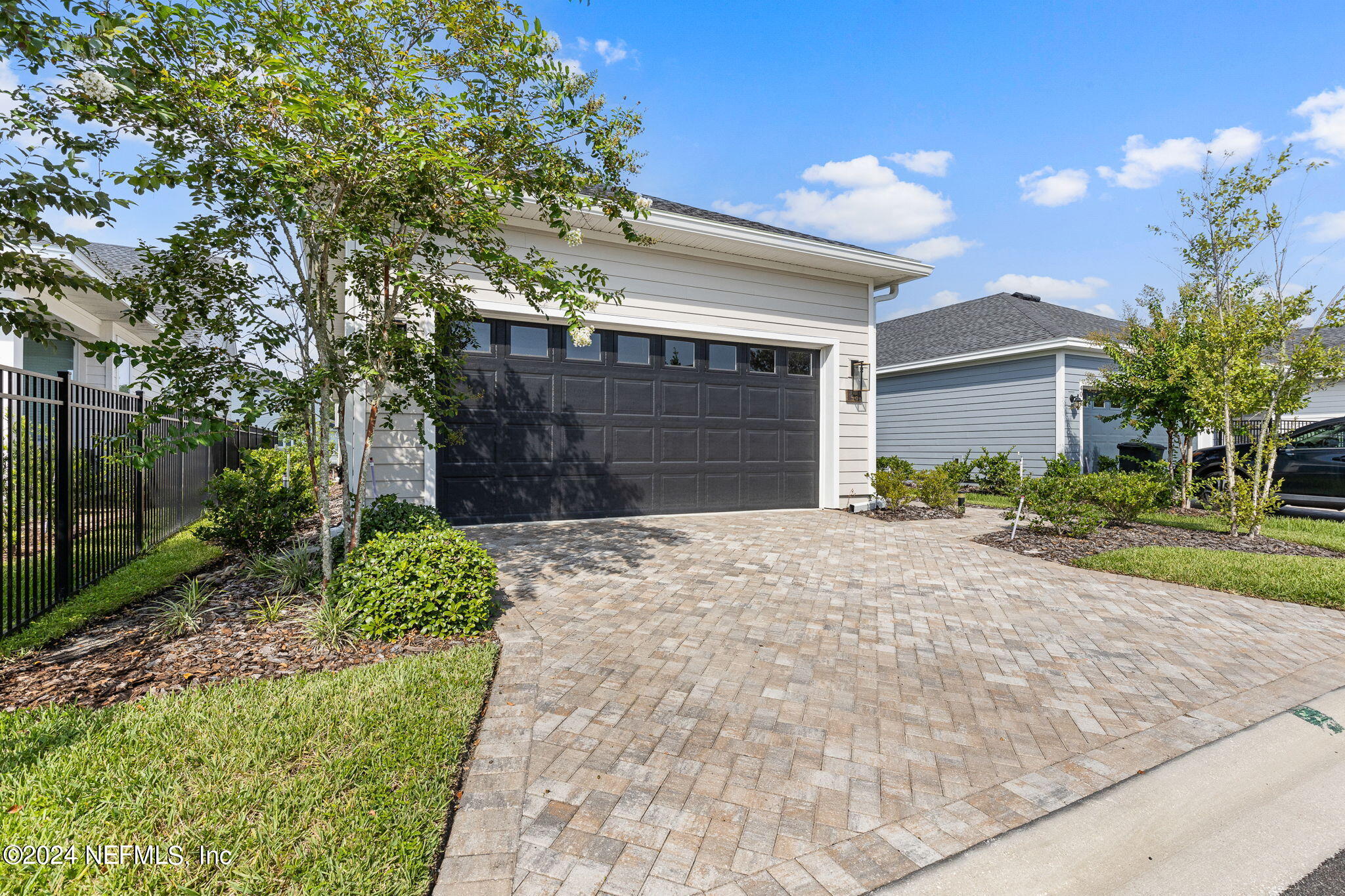 48 Bluebonnet Way St. Augustine, FL 32092 - Photo 3 of 47 a front view of a house with a yard and garage