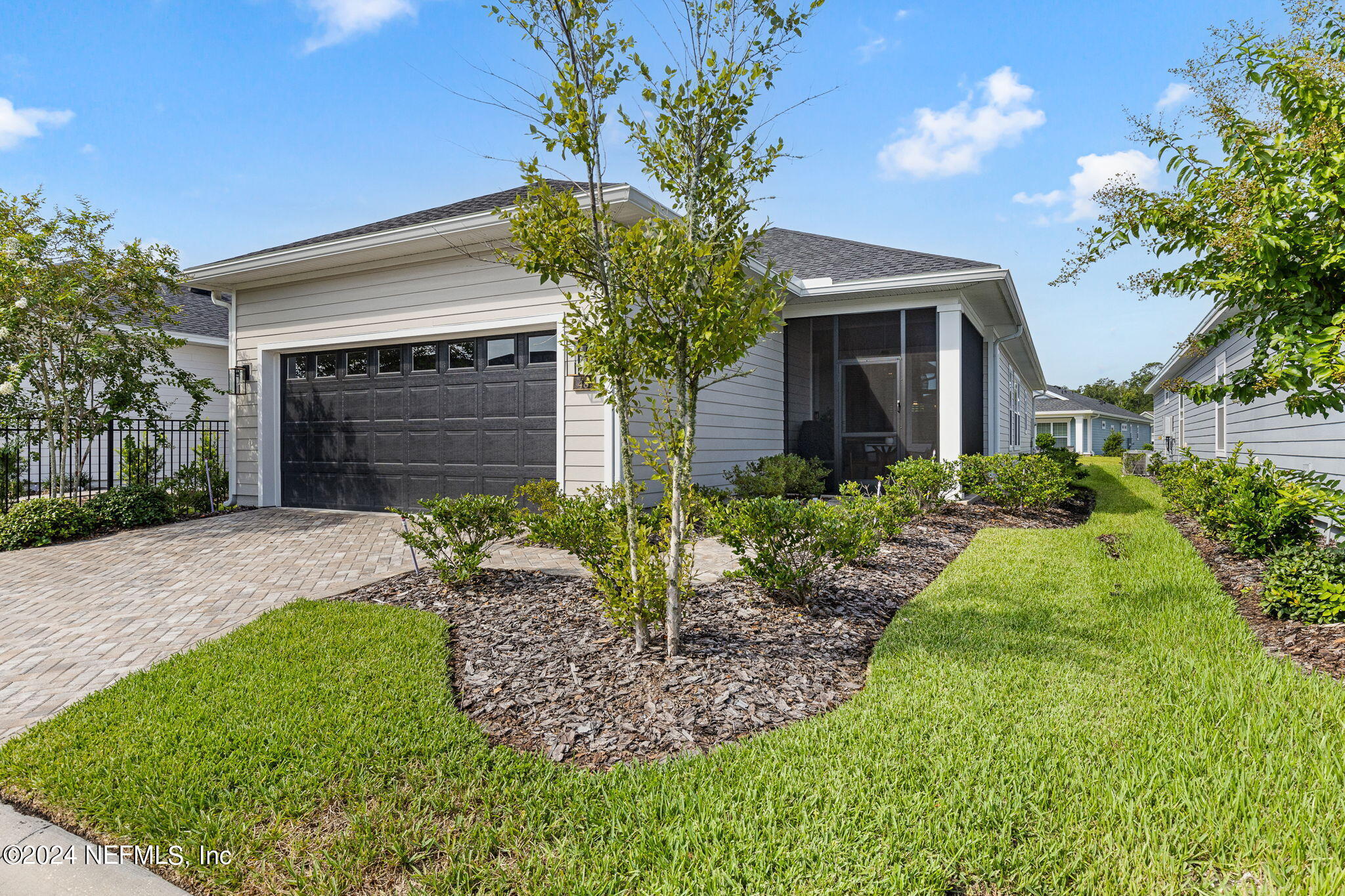 48 Bluebonnet Way St. Augustine, FL 32092 - Photo 6 of 47 a front view of a house with a garden