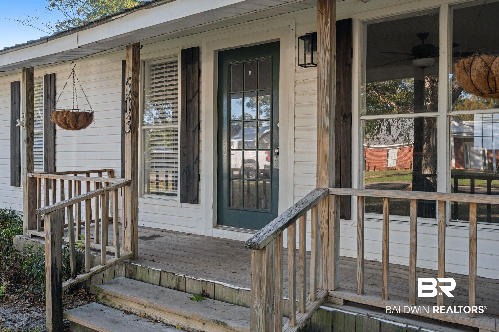 503 North Holly Street Foley, AL 36535 - Photo 9 of 23 View of exterior entry with covered porch and ceiling fan