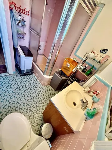 a bathroom with a toilet and a mirror