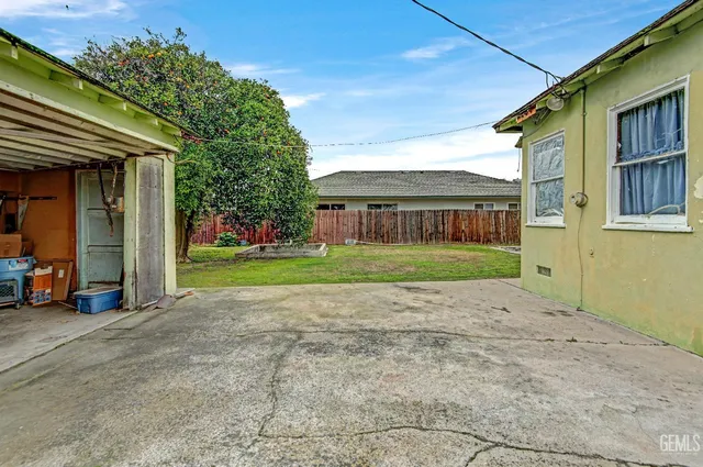 a view of an house with backyard porch and sitting area