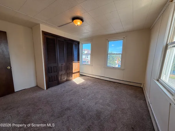 an empty room with windows