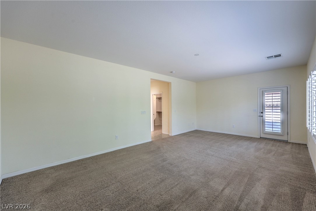 2276 Saxtons River Road Henderson, NV 89044 - Photo 18 of 49 Owner's Suite with Walk-In Closet, and Door to Back Patio