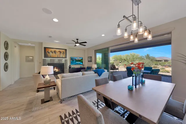 a view of a dining room with furniture wooden floor and chandelier