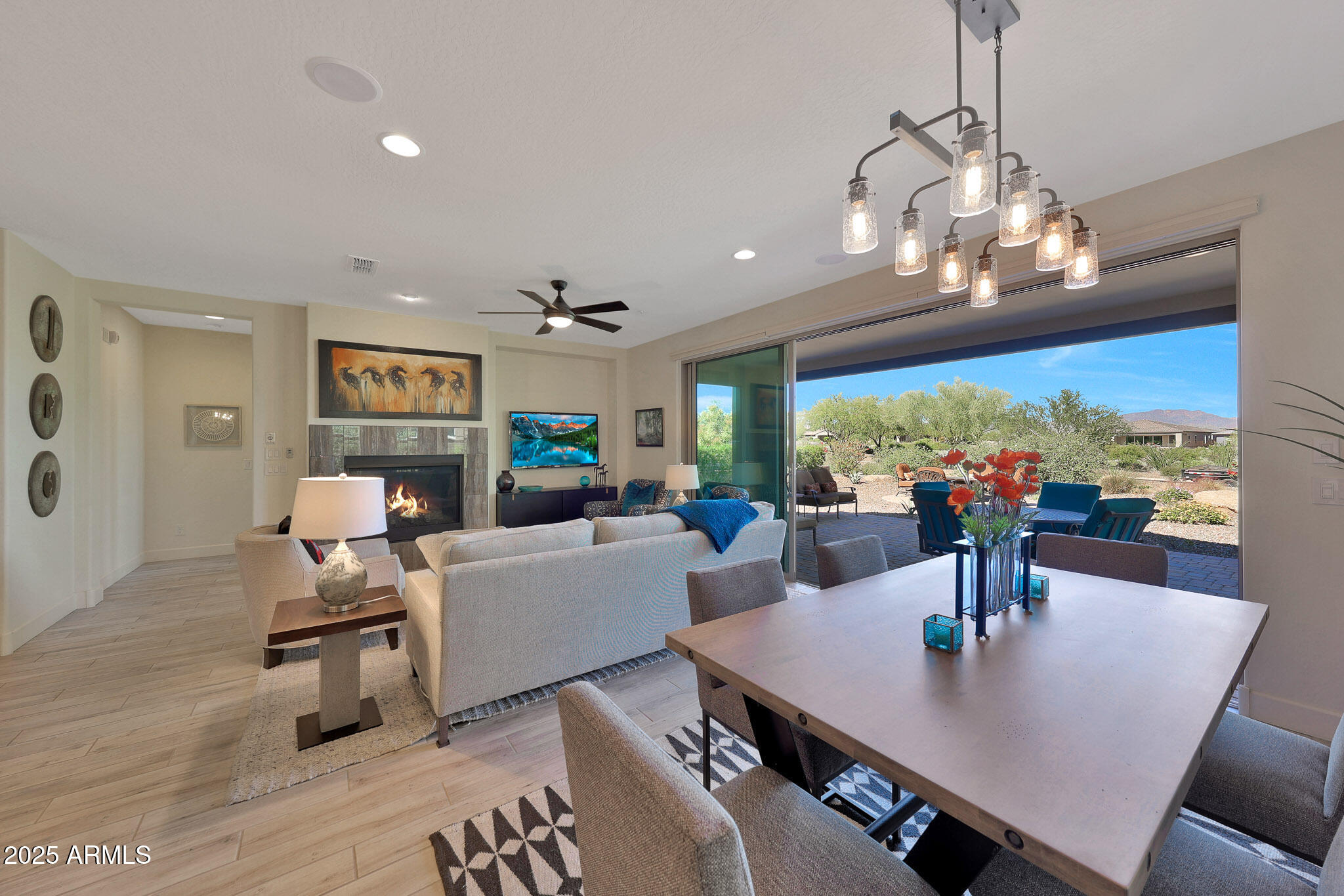 a view of a dining room with furniture wooden floor and chandelier