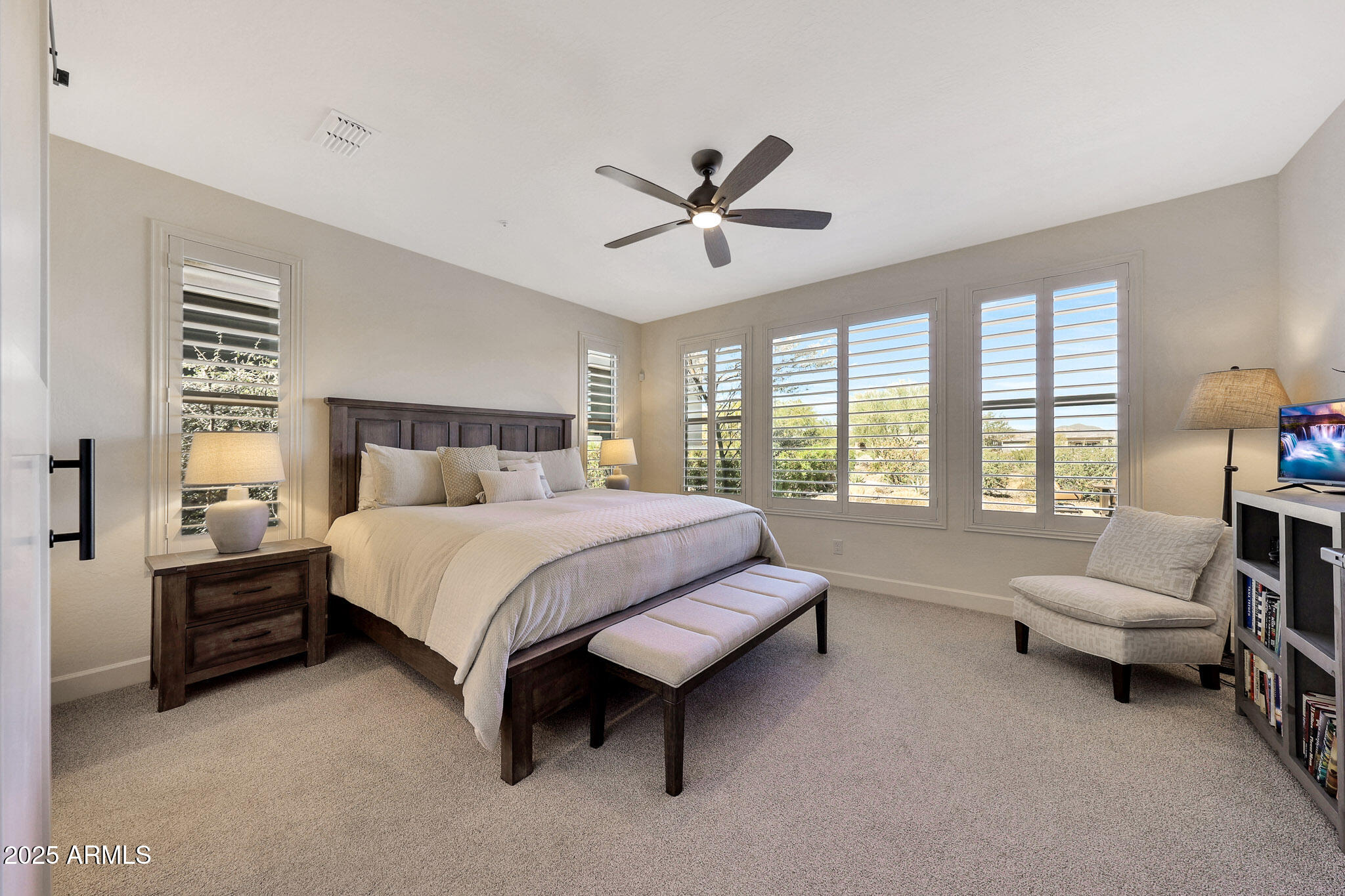 17940 East Cindercone Road Rio Verde, AZ 85263 - Photo 14 of 42 a spacious bedroom with a bed and a large window