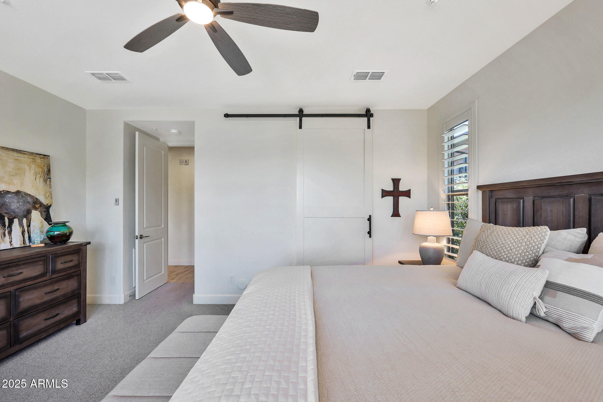 17940 East Cindercone Road Rio Verde, AZ 85263 - Photo 16 of 42 a bedroom with a bed and ceiling fan