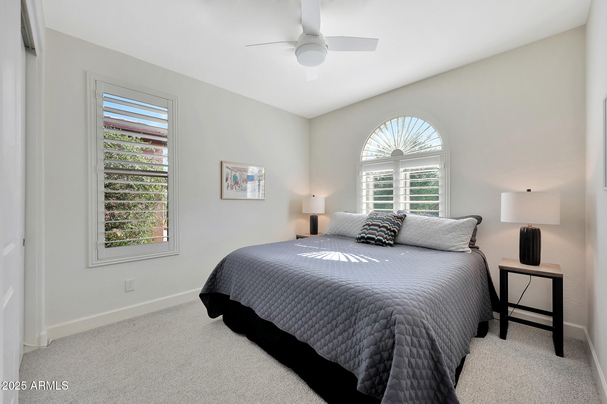 17940 East Cindercone Road Rio Verde, AZ 85263 - Photo 20 of 42 a bedroom with a bed and a large window