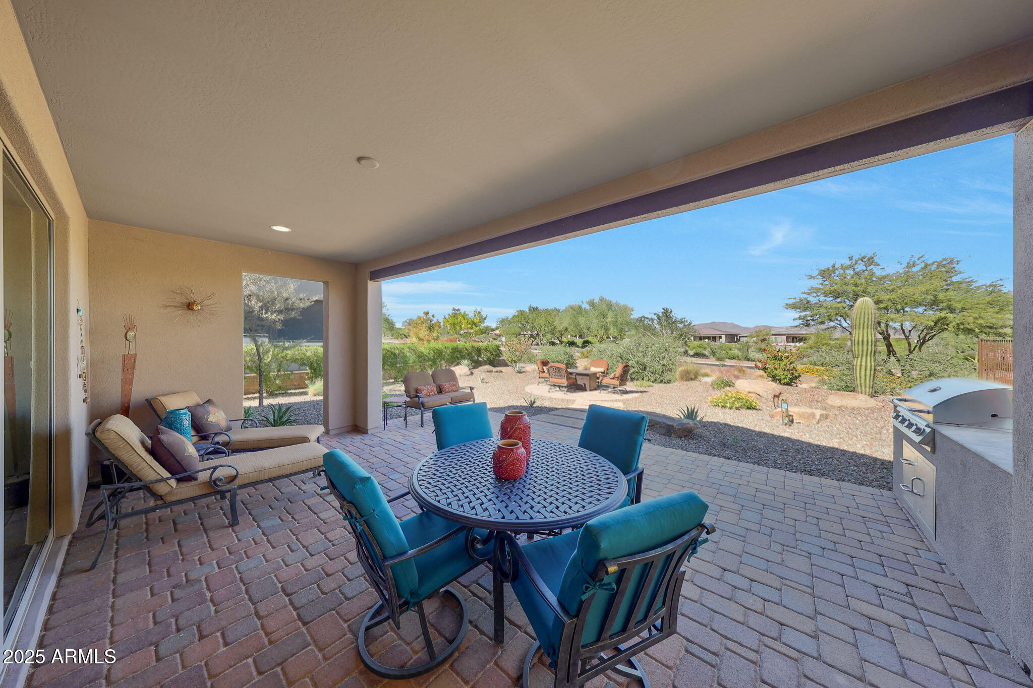 17940 East Cindercone Road Rio Verde, AZ 85263 - Photo 25 of 42 a living room with furniture a rug and a floor to ceiling window