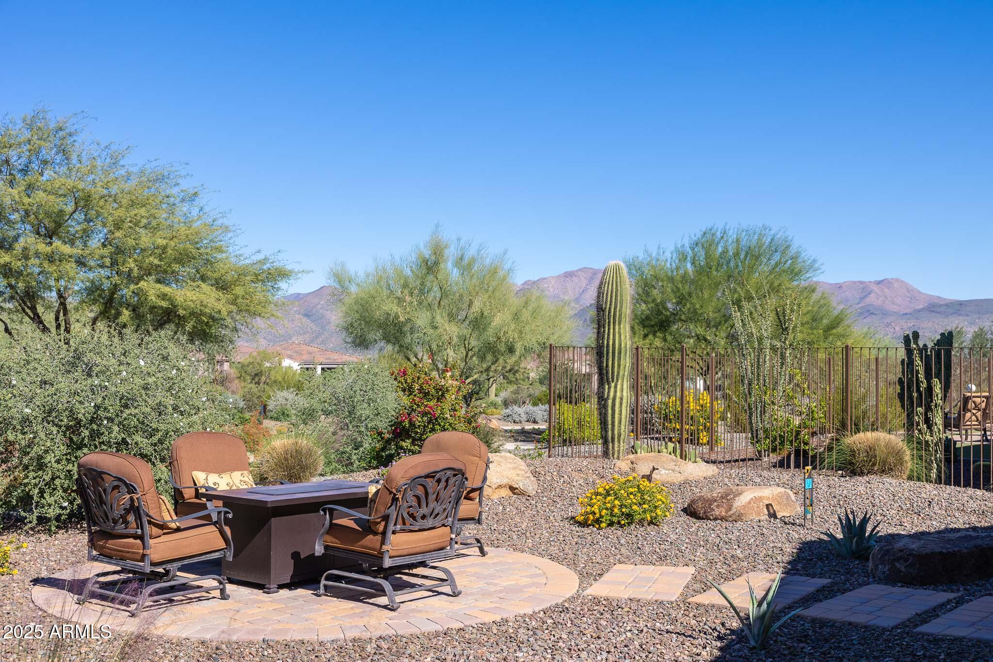 17940 East Cindercone Road Rio Verde, AZ 85263 - Photo 29 of 42 a view of a backyard with sitting area and furniture