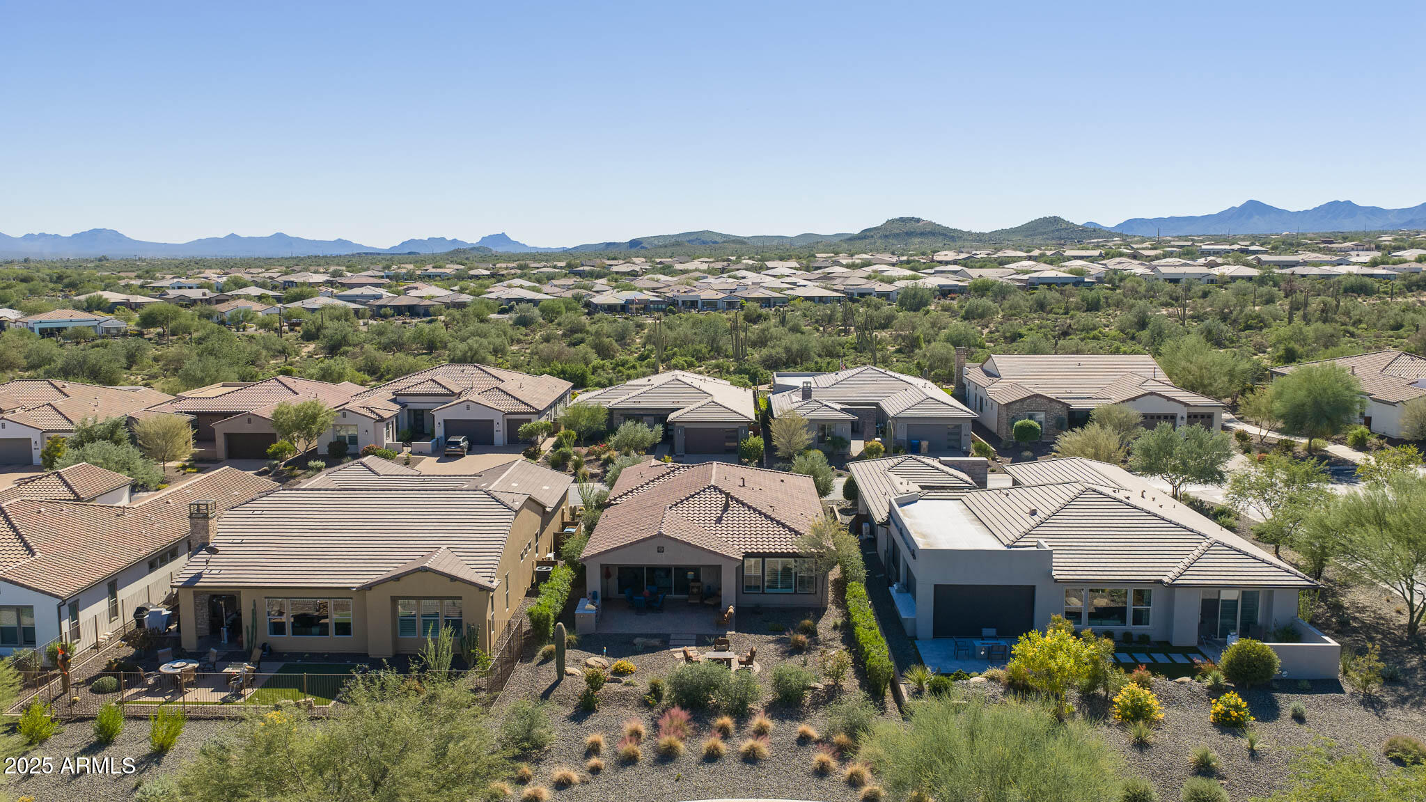 17940 East Cindercone Road Rio Verde, AZ 85263 - Photo 39 of 42 a view of a town with mountains in the background