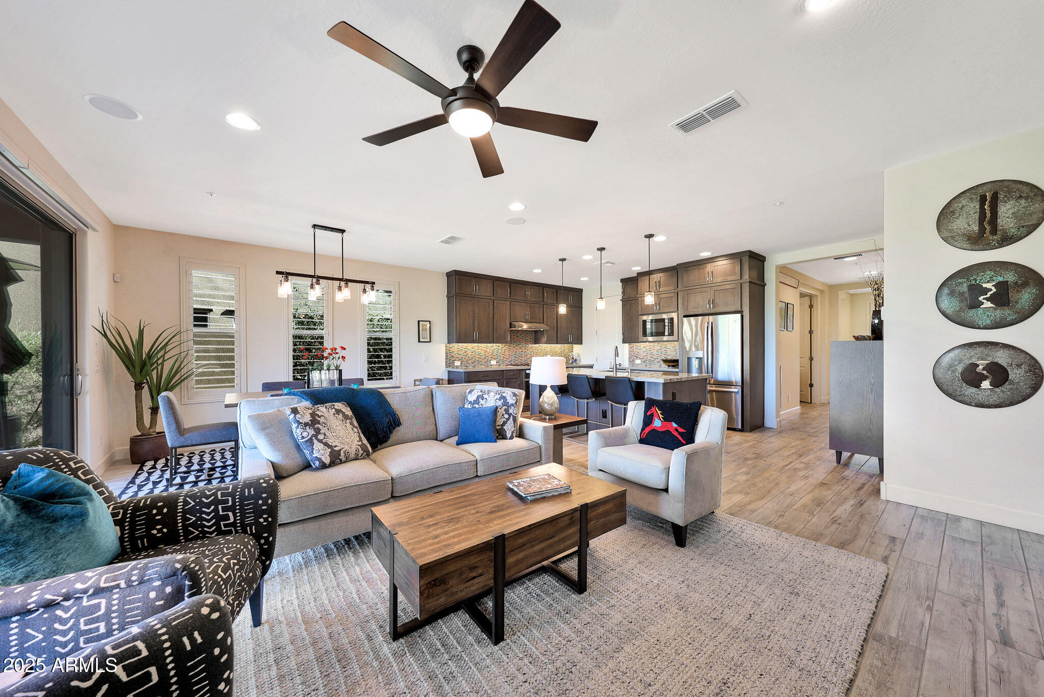 17940 East Cindercone Road Rio Verde, AZ 85263 - Photo 4 of 42 a living room with furniture and a wooden floor