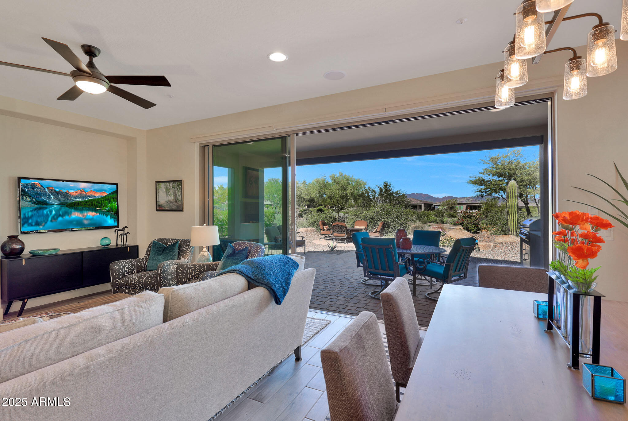 17940 East Cindercone Road Rio Verde, AZ 85263 - Photo 7 of 42 a living room with furniture and a floor to ceiling window