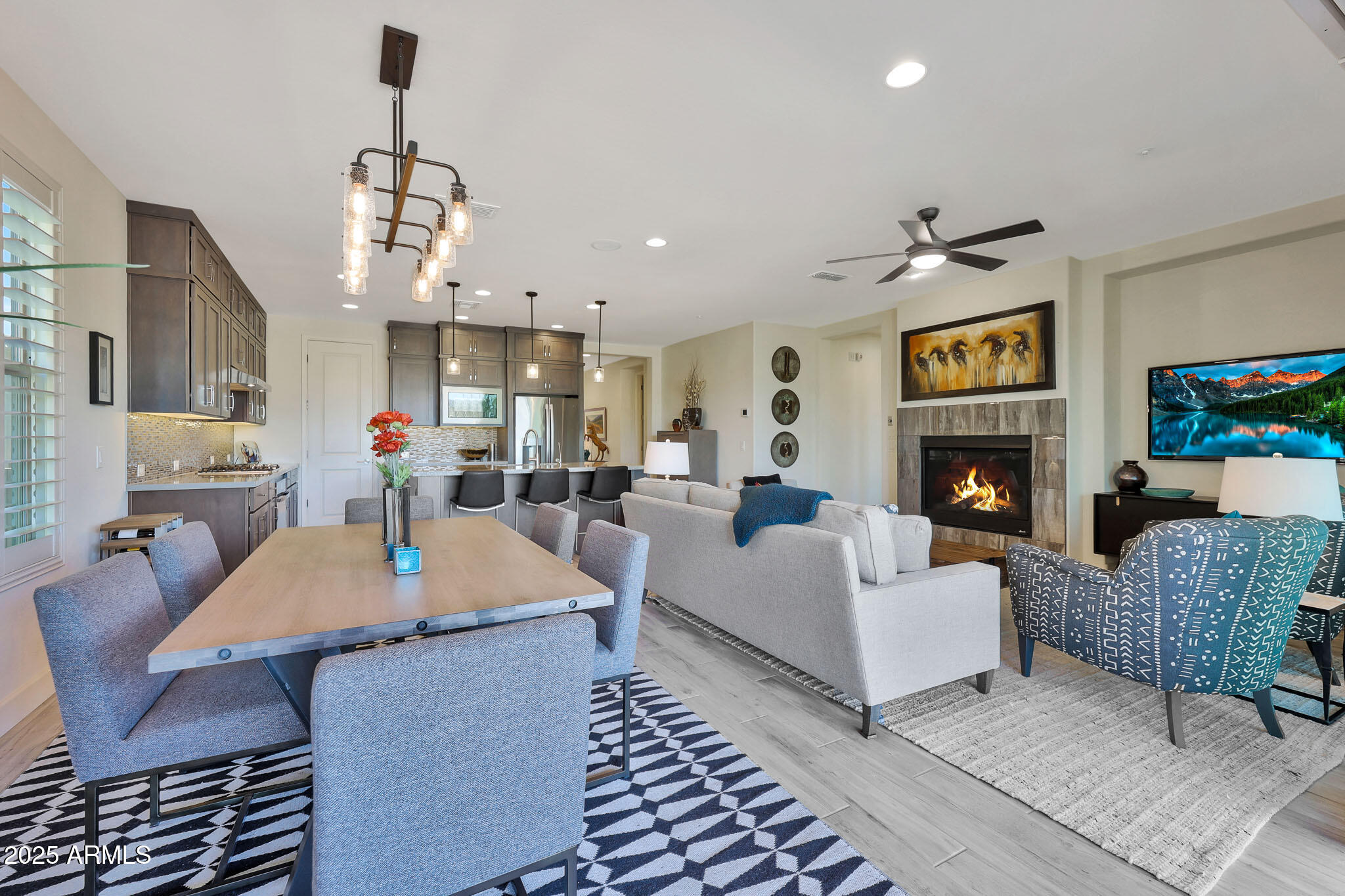 17940 East Cindercone Road Rio Verde, AZ 85263 - Photo 8 of 42 a living room with furniture a table and kitchen view