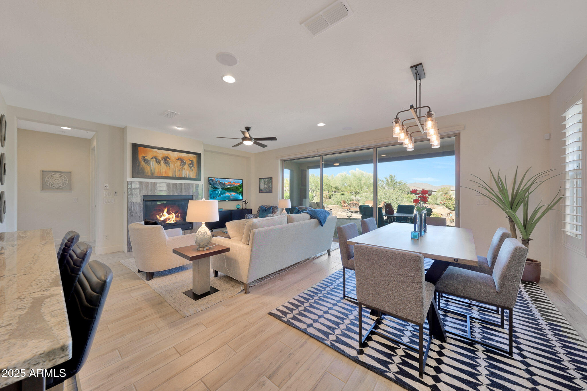 17940 East Cindercone Road Rio Verde, AZ 85263 - Photo 9 of 42 a living room with furniture and a chandelier