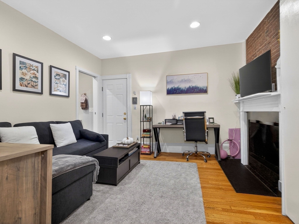 52 Temple Street Boston, MA 02114 - Photo 17 of 34 a living room with furniture fireplace and flat screen tv