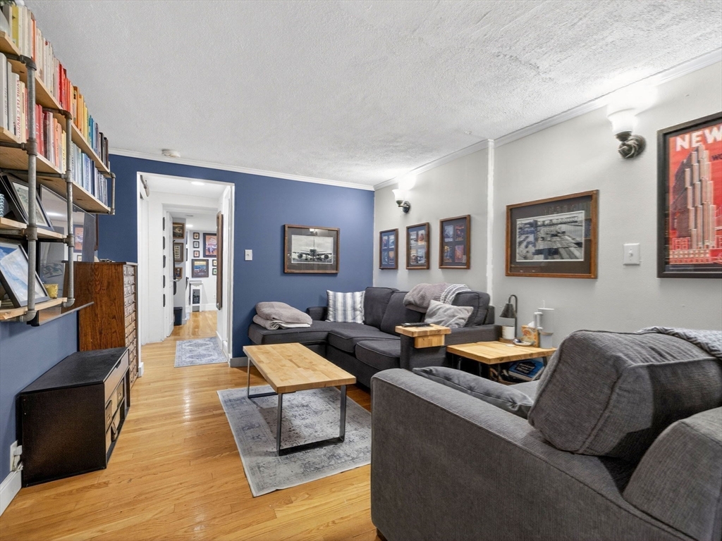 52 Temple Street Boston, MA 02114 - Photo 23 of 34 a living room with furniture and a fireplace