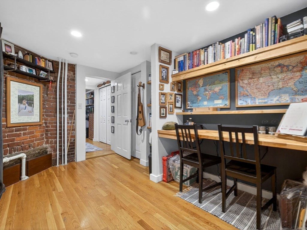 52 Temple Street Boston, MA 02114 - Photo 25 of 34 a workspace with furniture window and wooden floor