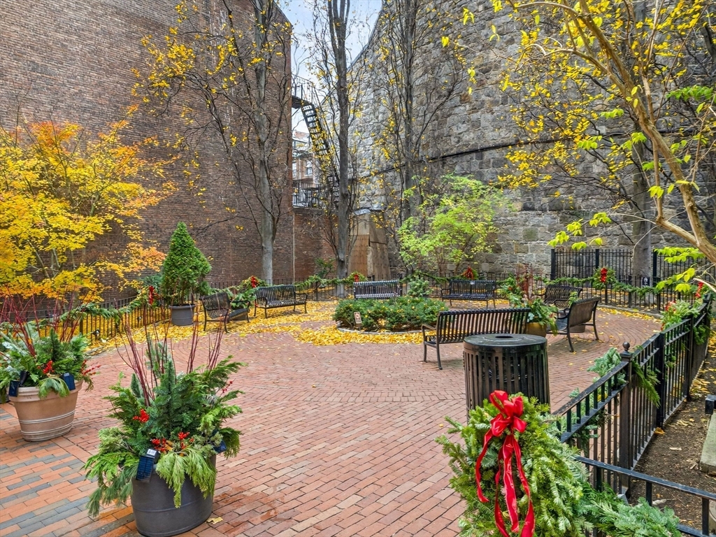 52 Temple Street Boston, MA 02114 - Photo 32 of 34 a view of a swimming pool with a patio