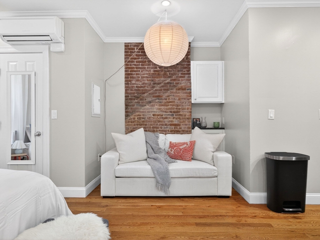 52 Temple Street Boston, MA 02114 - Photo 6 of 34 a living room with furniture and a potted plant