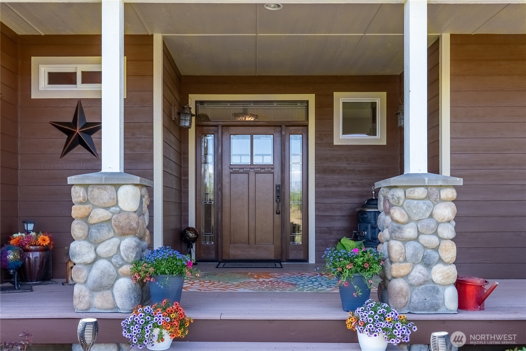 23 George Road Omak, WA 98841 - Photo 9 of 40 a front view of a house with an outdoor seating