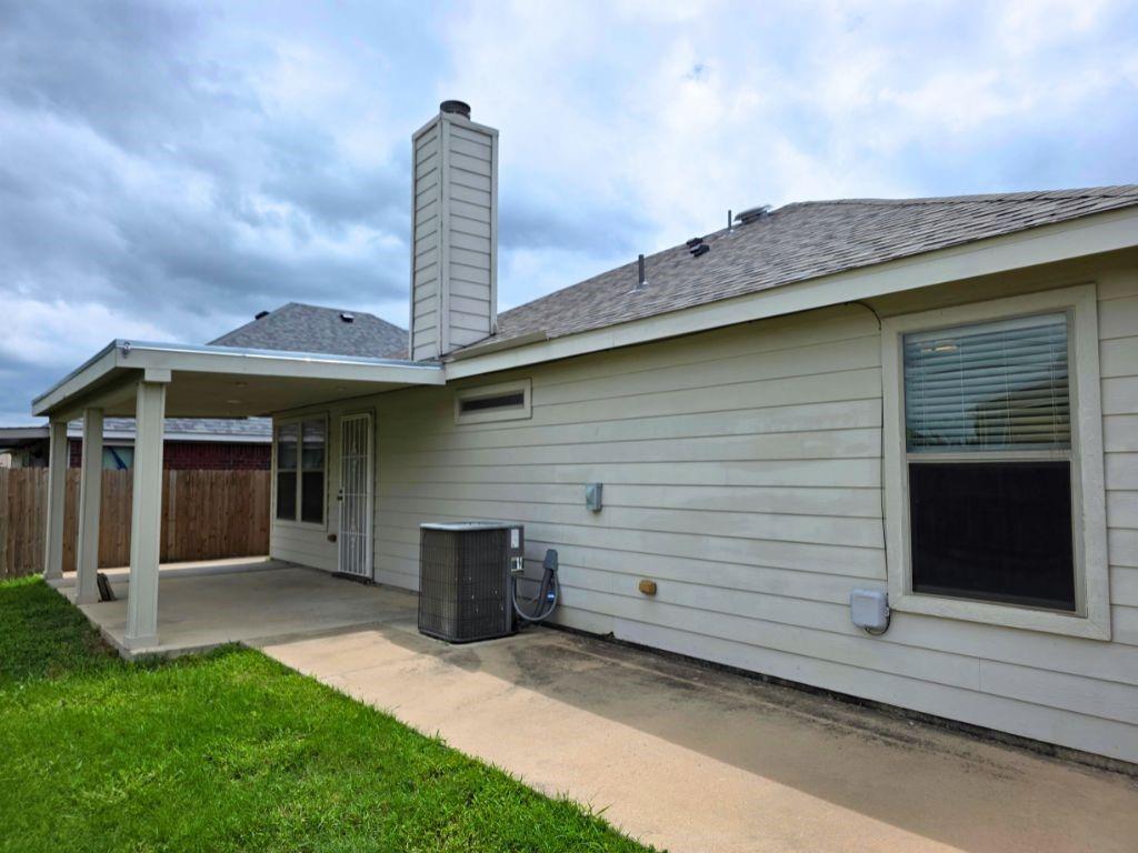 6320 Spring Ranch Drive Fort Worth, TX 76179 - Photo 19 of 24 Covered patio with a concrete slab and a fenced perimeter