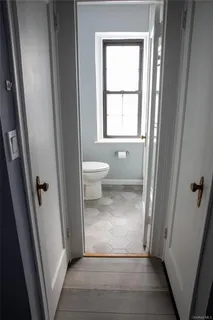 a view of a bathroom with a toilet