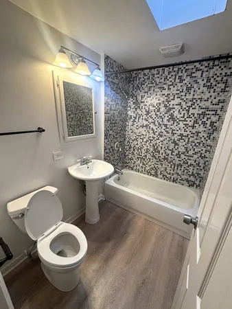 a bathroom with a toilet and a sink