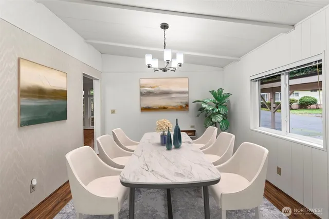 a kitchen with stainless steel appliances granite countertop a refrigerator a stove and a sink with granite countertops