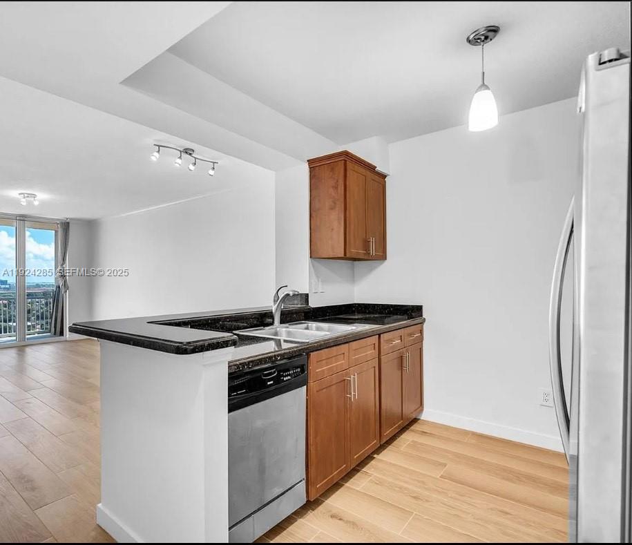 2665 Southwest 37th Avenue, Unit 1501 Miami, FL 33133 - Photo 3 of 10 a kitchen with stainless steel appliances granite countertop a stove and a sink
