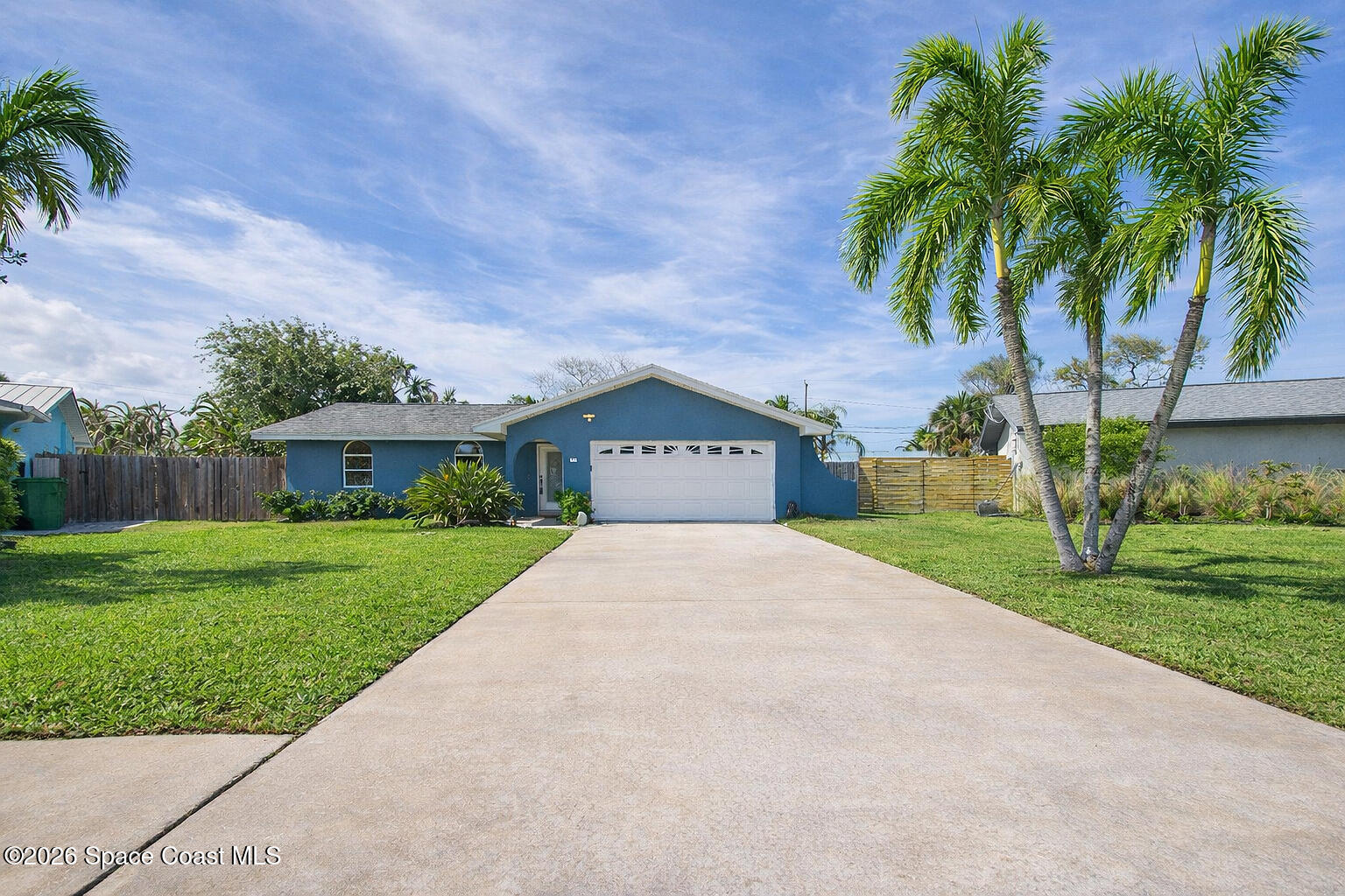 280 Coral Way West Indialantic, FL 32903 - Photo 1 of 72 a view of a house with a yard and palm trees