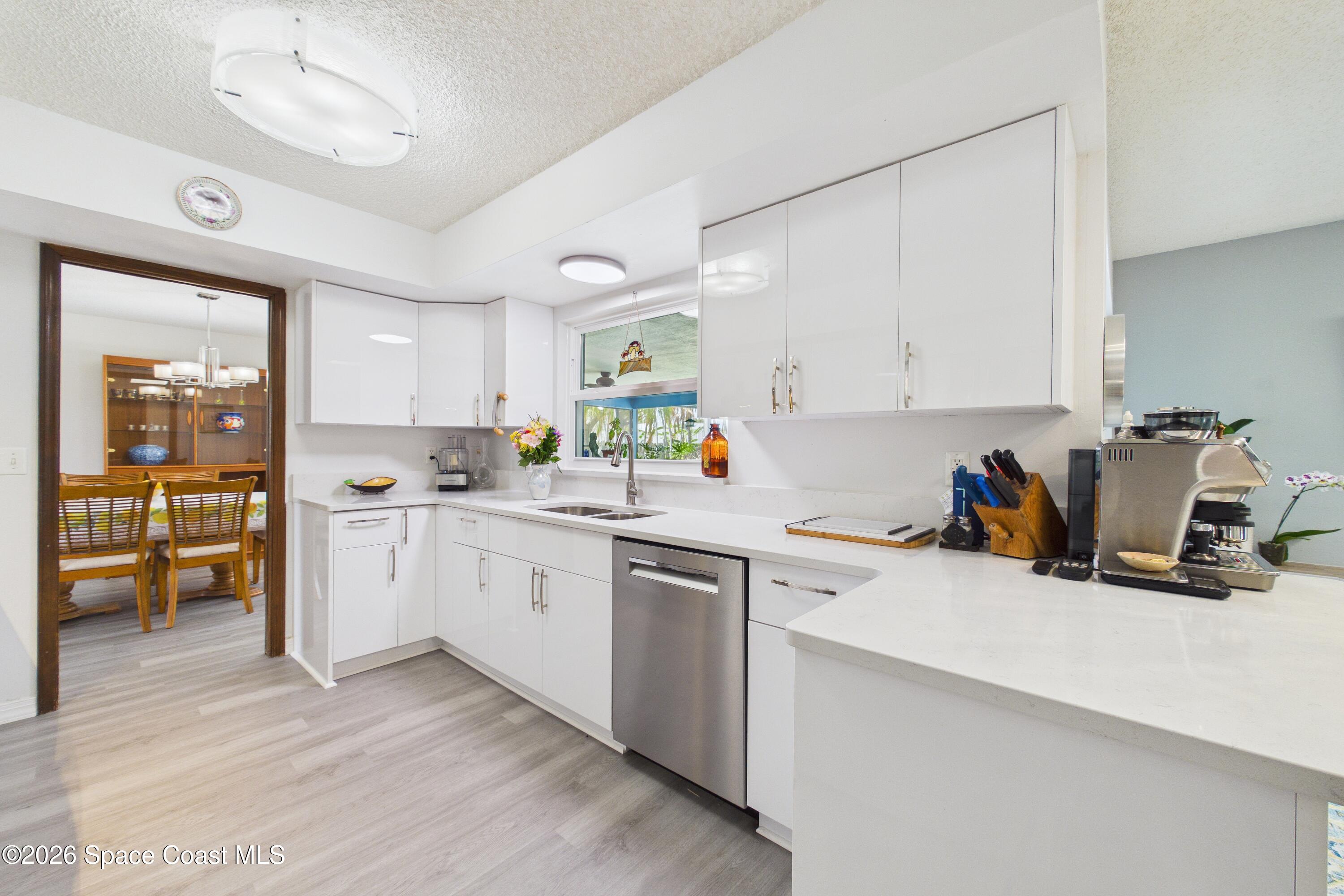 280 Coral Way West Indialantic, FL 32903 - Photo 13 of 72 a kitchen with a sink cabinets and window