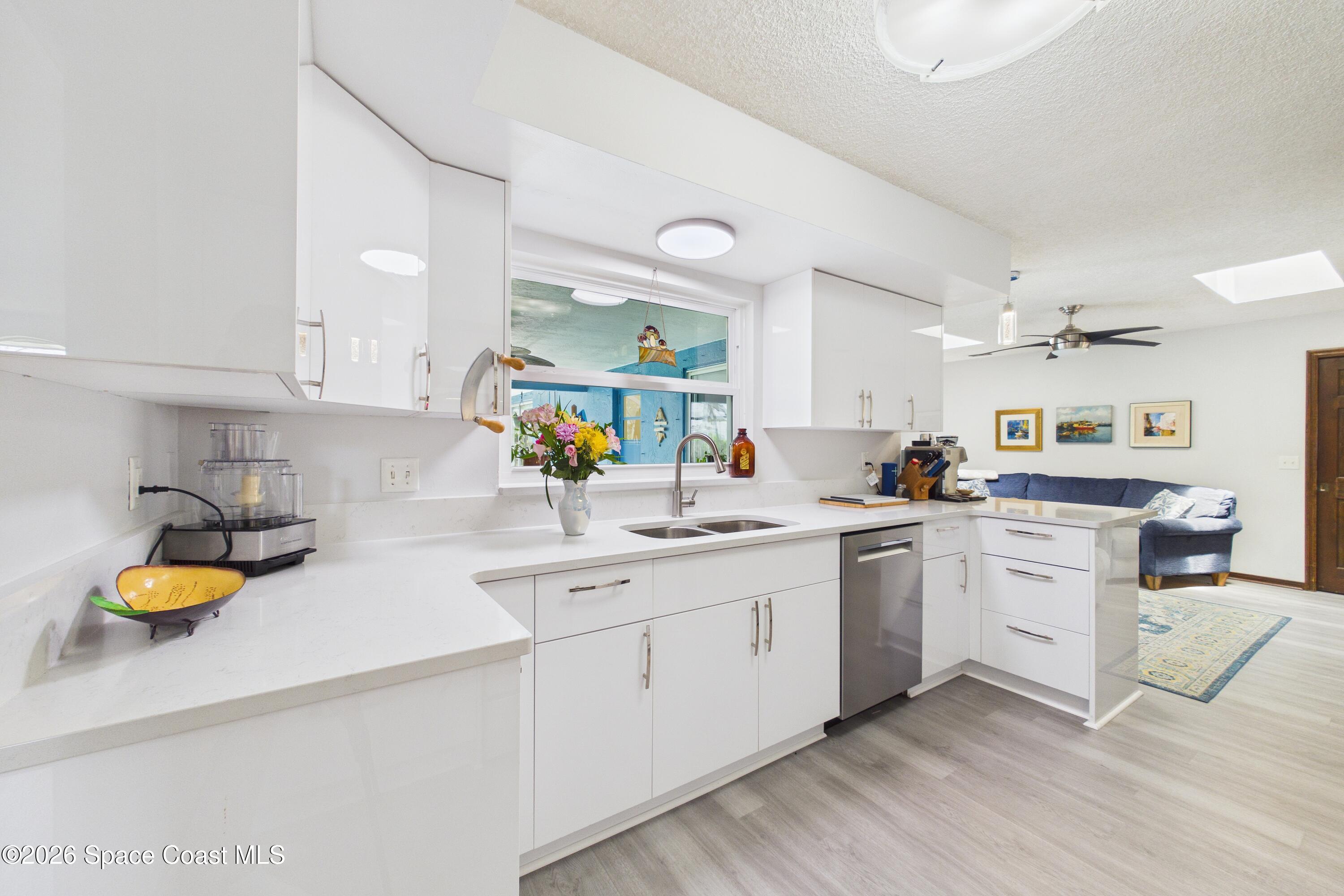 280 Coral Way West Indialantic, FL 32903 - Photo 14 of 72 a kitchen with sink cabinets and appliances