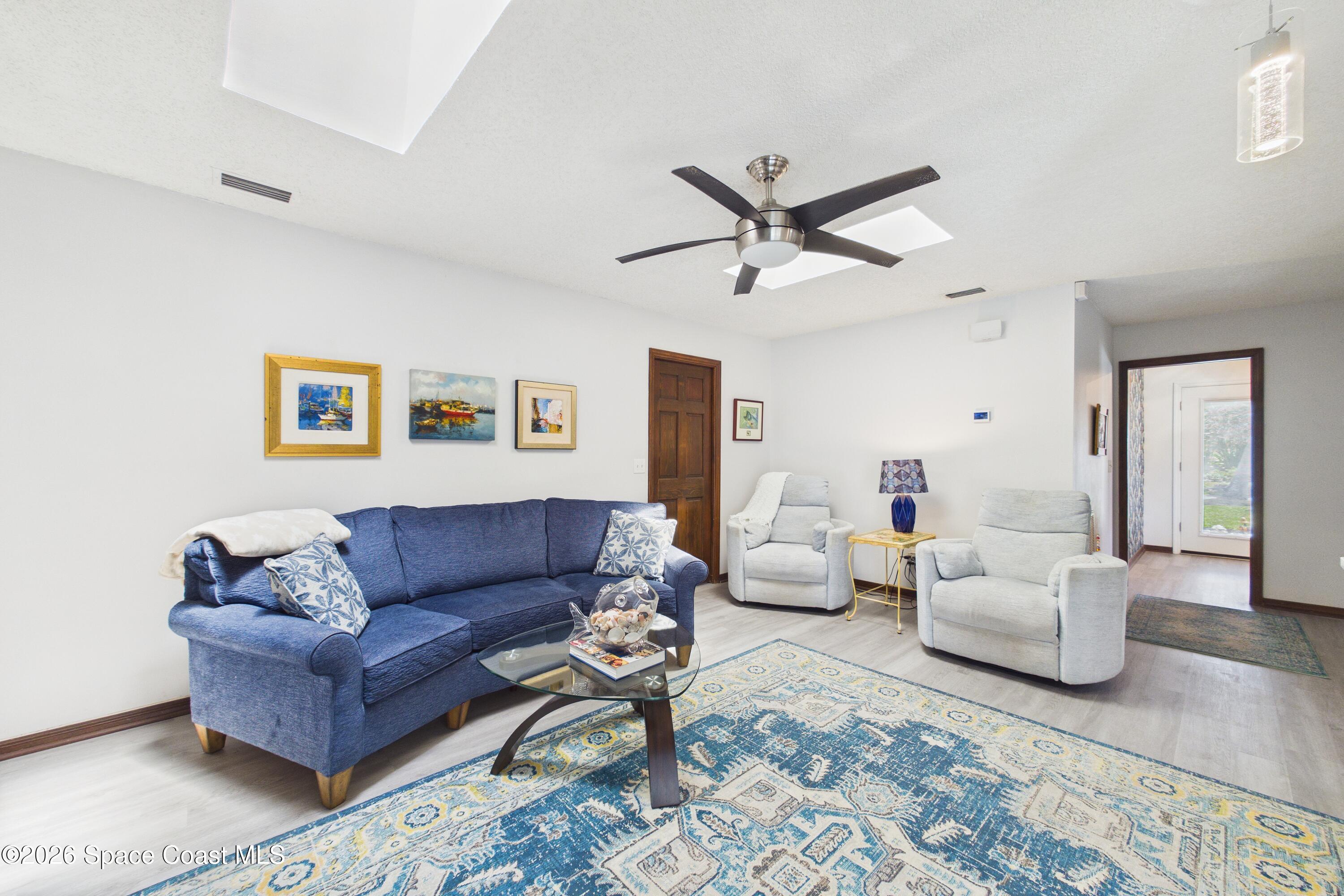 280 Coral Way West Indialantic, FL 32903 - Photo 19 of 72 a living room with furniture and a large window