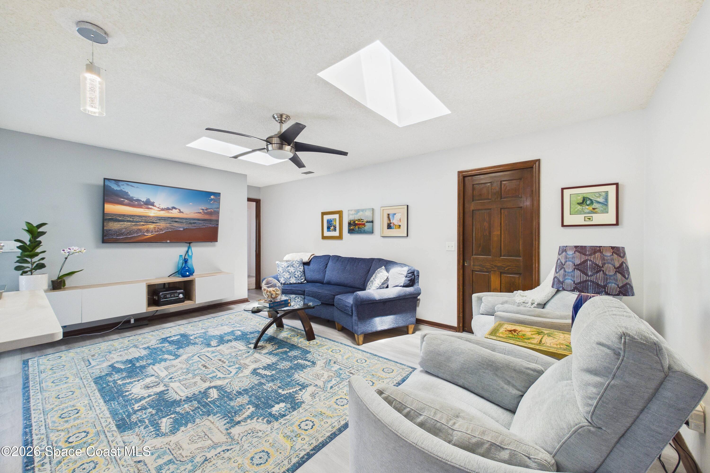 280 Coral Way West Indialantic, FL 32903 - Photo 20 of 72 a living room with furniture and a flat screen tv