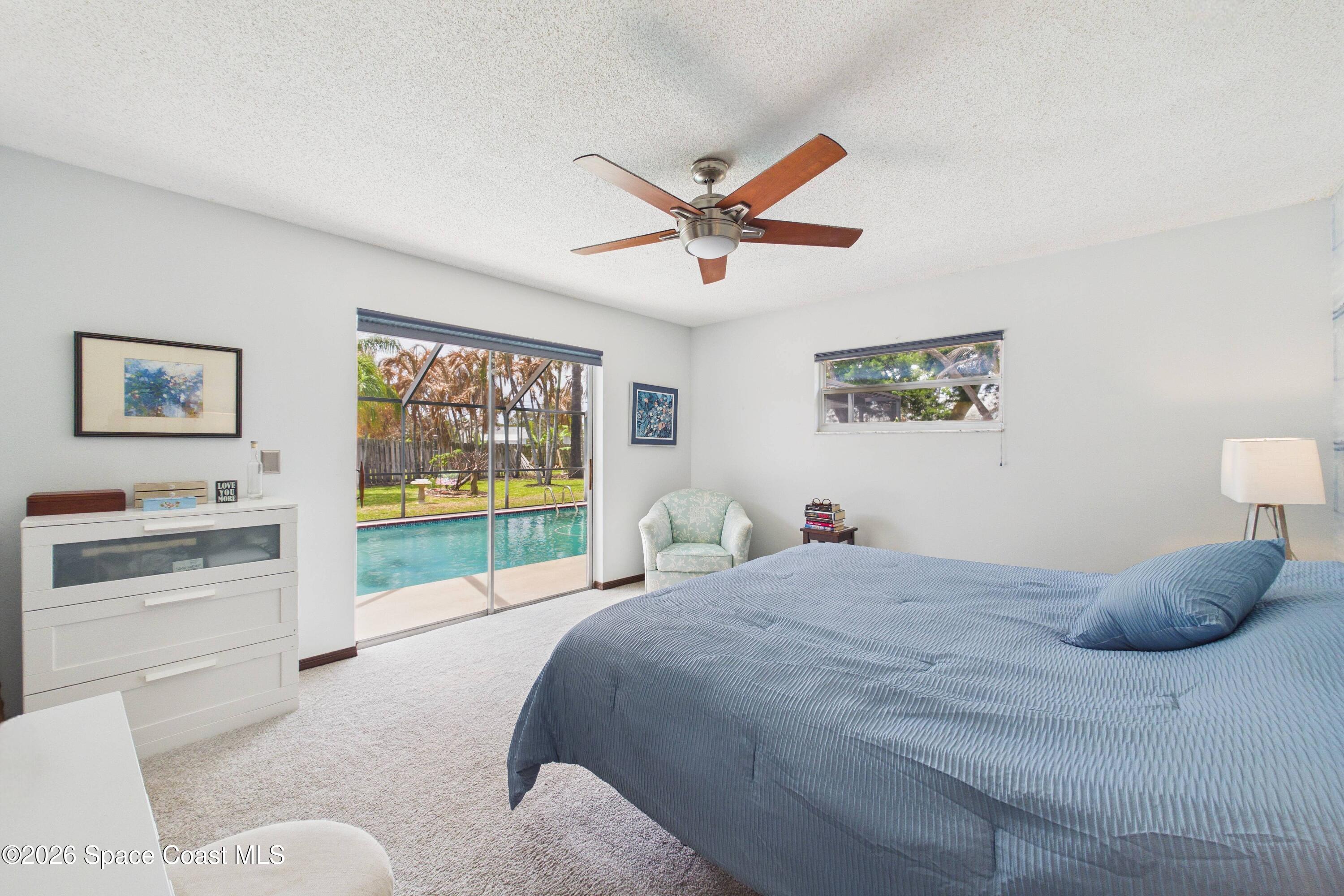 280 Coral Way West Indialantic, FL 32903 - Photo 23 of 72 a bedroom with a bed and a painting on the wall