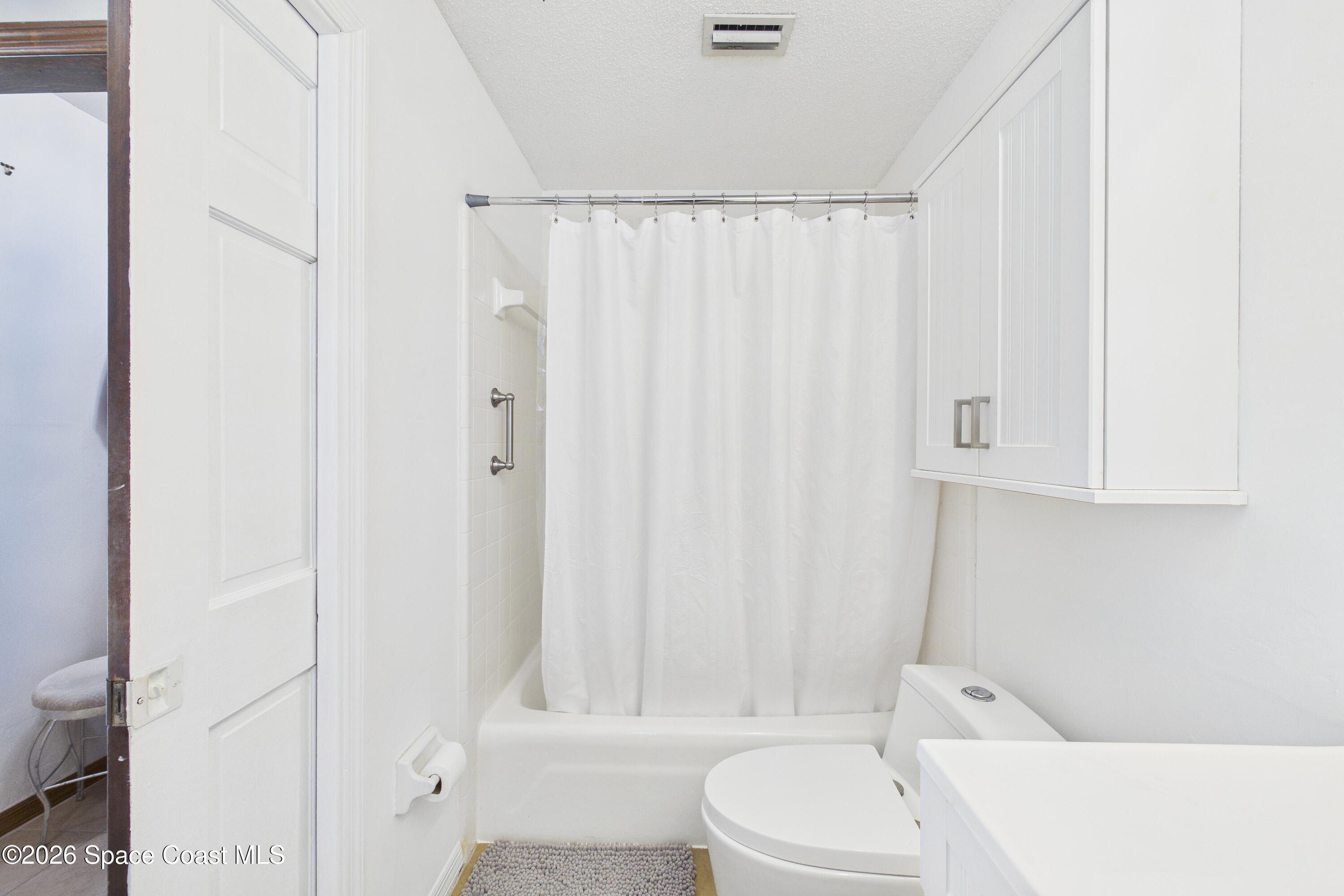 280 Coral Way West Indialantic, FL 32903 - Photo 40 of 72 a bathroom with a toilet and shower